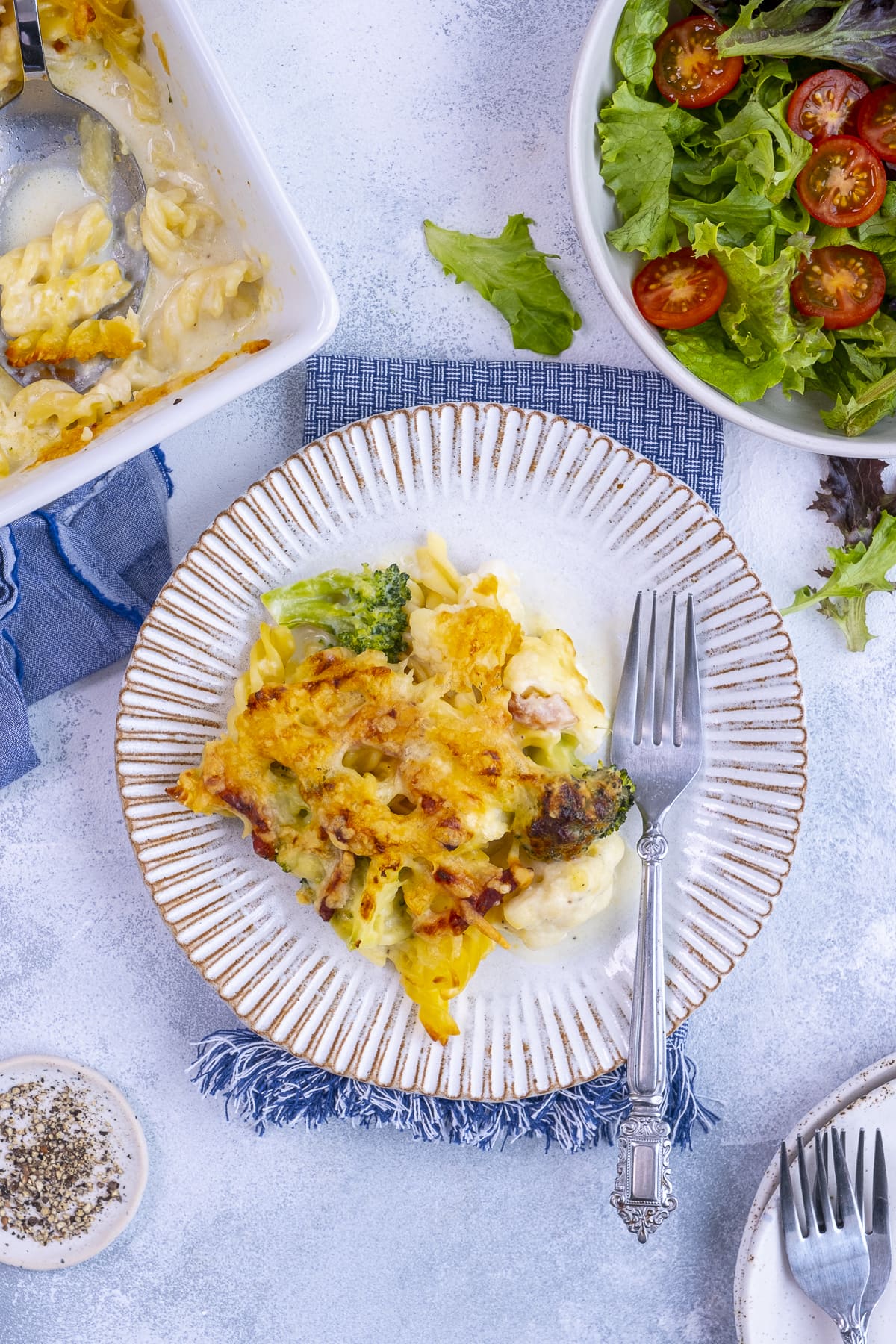 One portion of Cauliflower, Broccoli and Bacon Pasta Bake on a plate