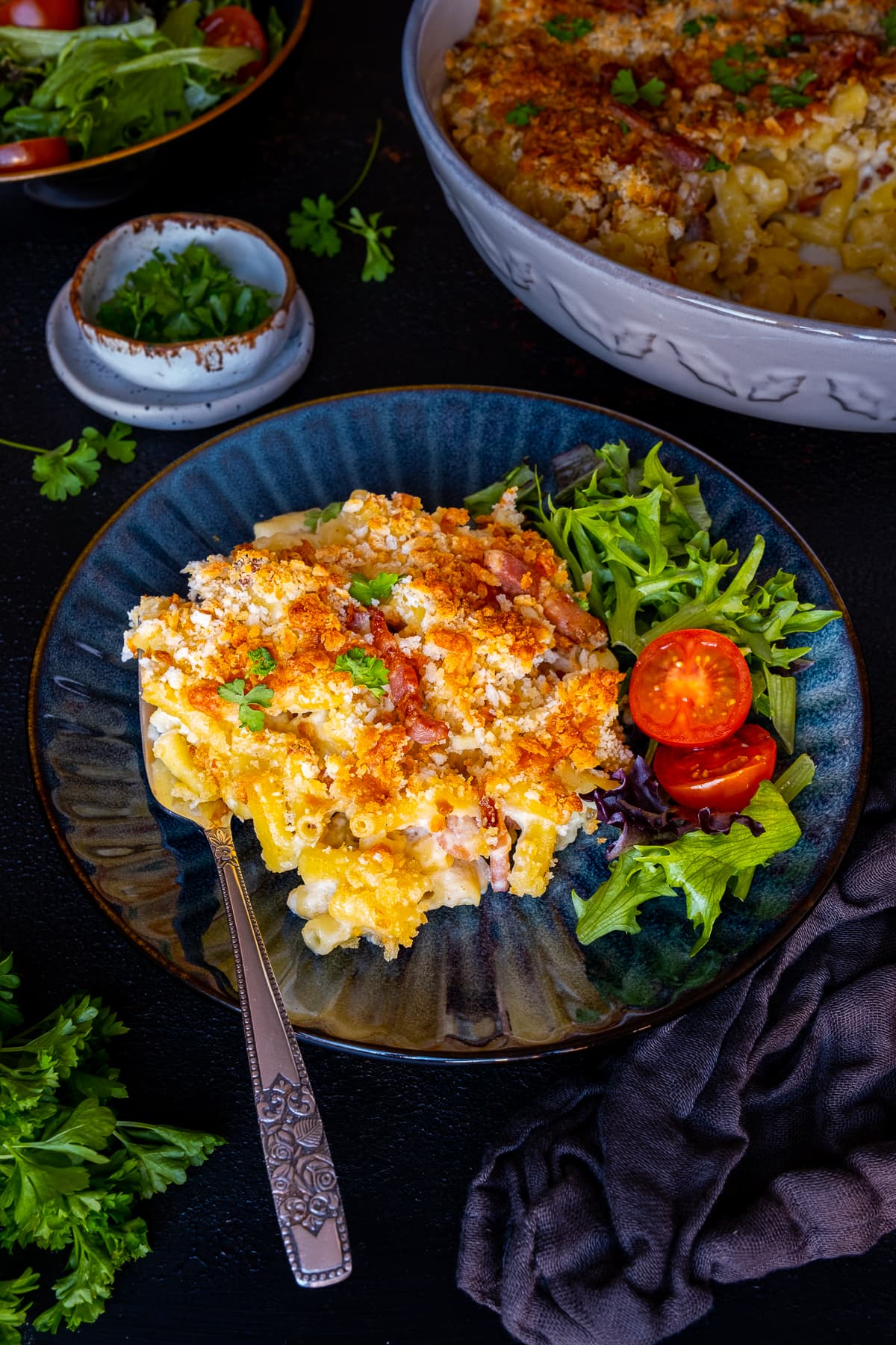 Easy Bacon Macaroni Cheese on a plate with a side salad of lettuce and tomatoes