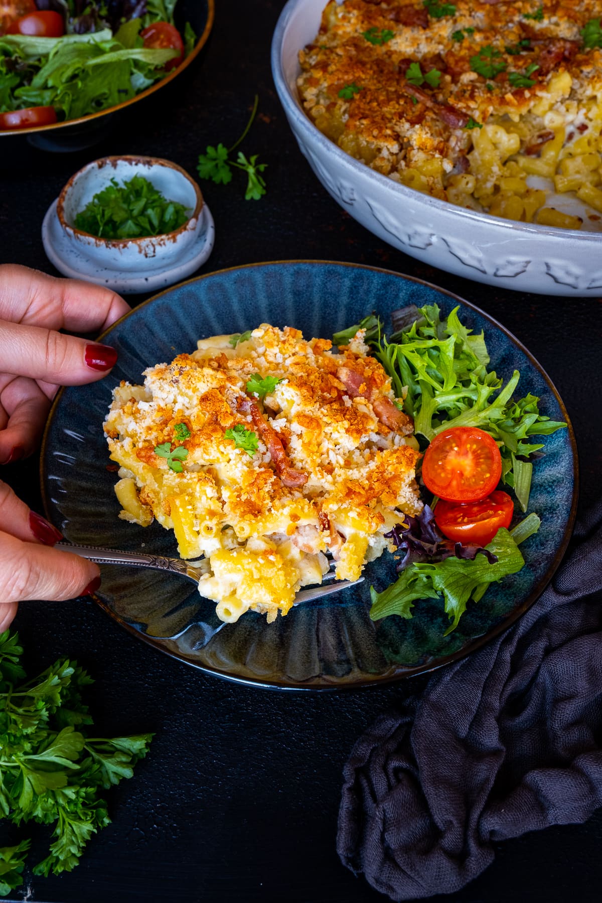 Easy Bacon Macaroni Cheese on a plate with a side salad of lettuce and tomatoes