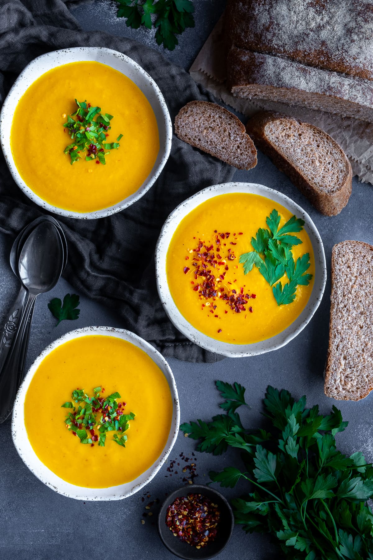 Overhead shot of 3 bowls of Easy Carrot and Butternut Squash Soup