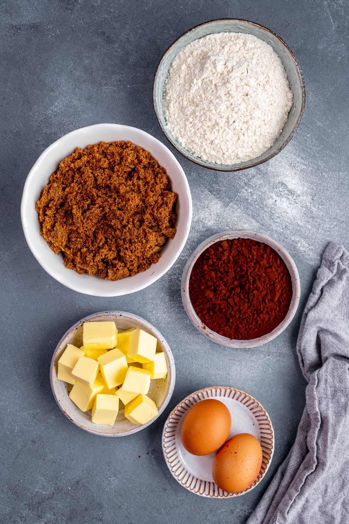 Ingredients for Easy Cocoa Powder Brownies: butter, flour, cocoa powder, eggs and sugar