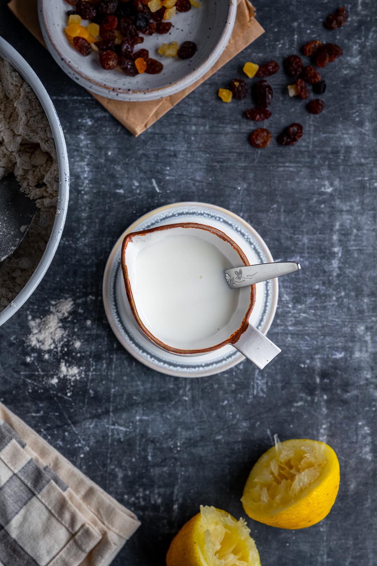 Overhead shot of milk and lemon juice in a small jug.