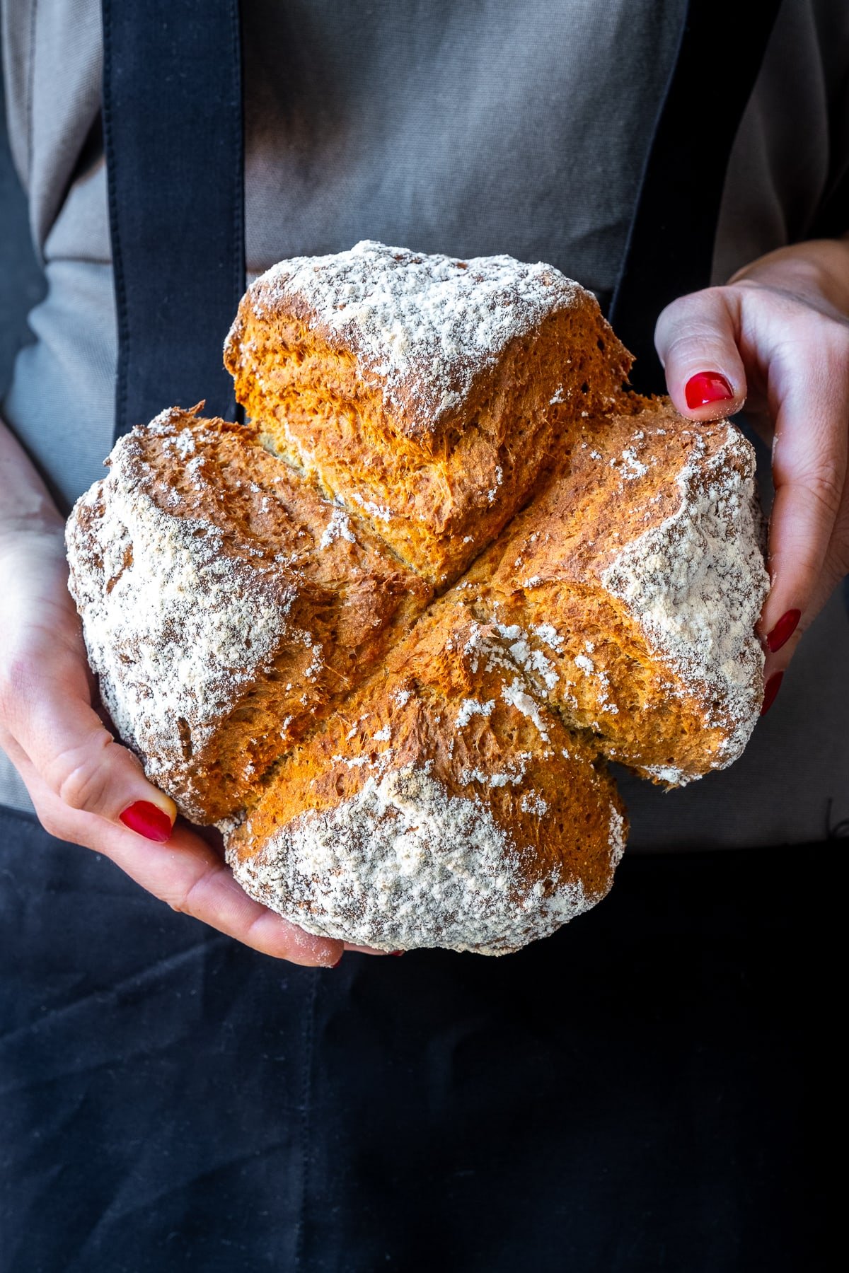 Easy Irish Soda Bread with Yogurt being held up to the camera