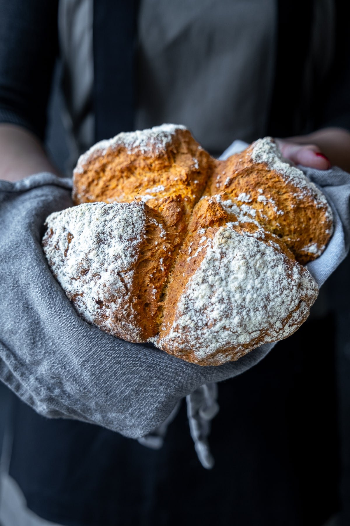 Easy Irish Soda Bread with Yogurt being held up to the camera