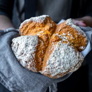 Easy Irish Soda Bread with Yogurt being held up to the camera