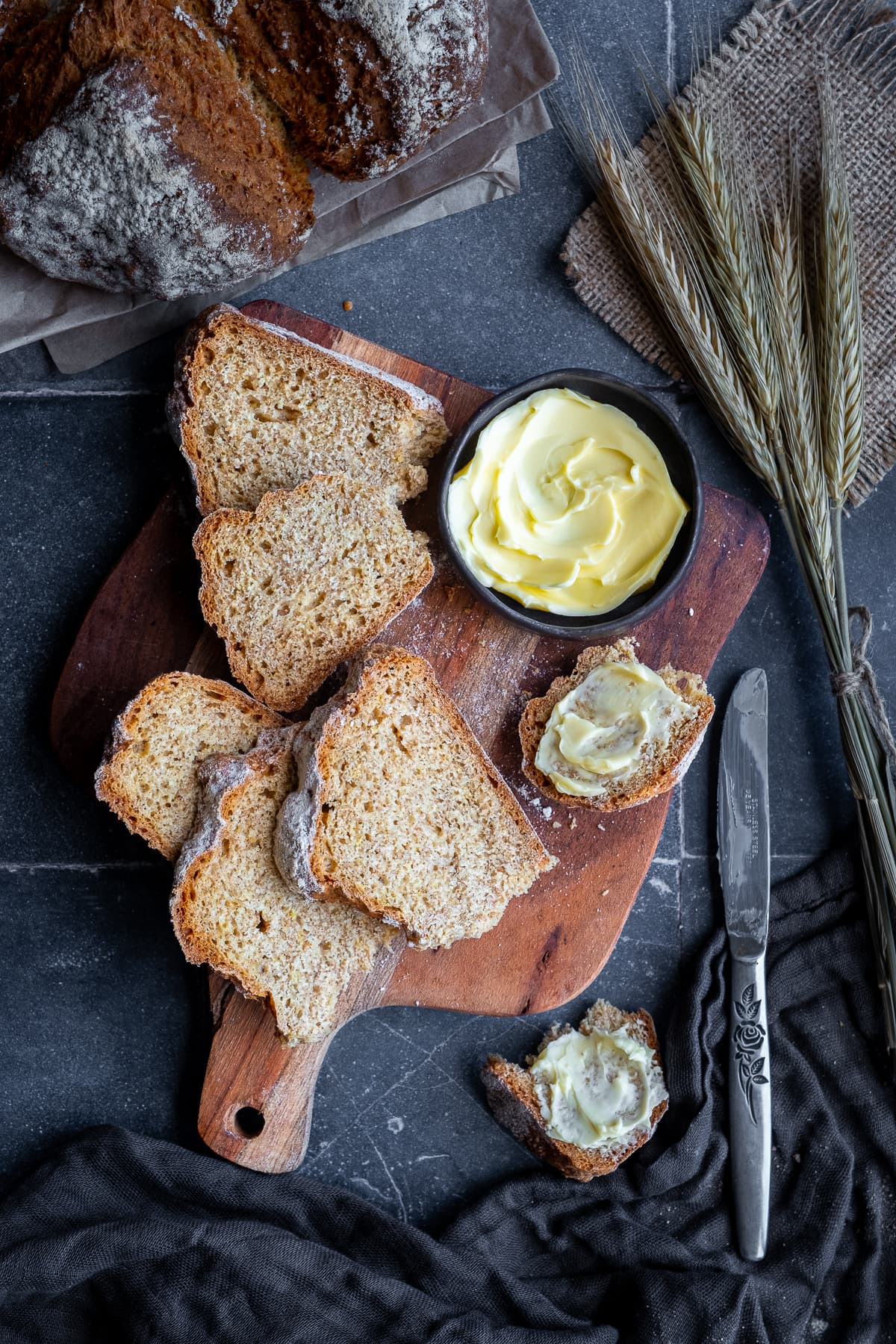 Overhead shot of Easy Irish Soda Bread with Yogurt sliced on a board.