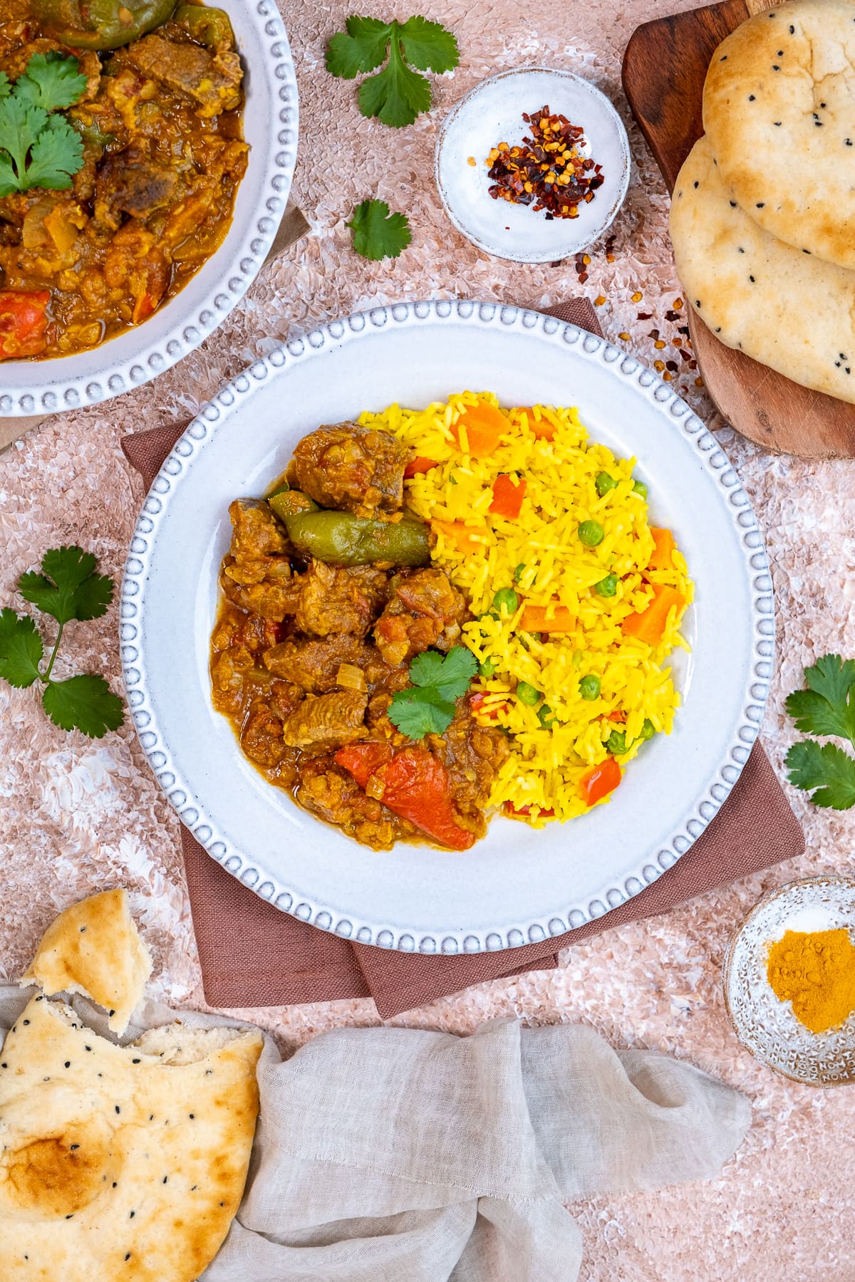 Lamb Dhansak on a plate with Vegetable Pilau Rice 