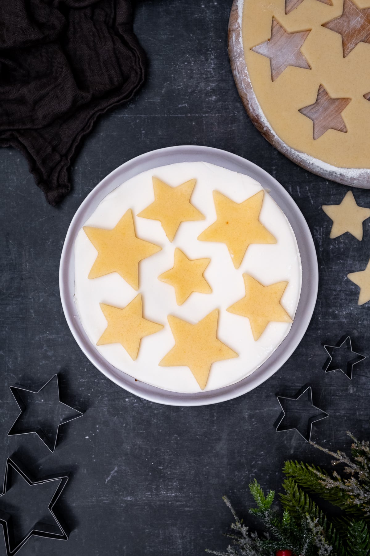 Overhead shot of Easy Mincemeat Christmas Cake - showing white fondant icing covered with marzipan stars