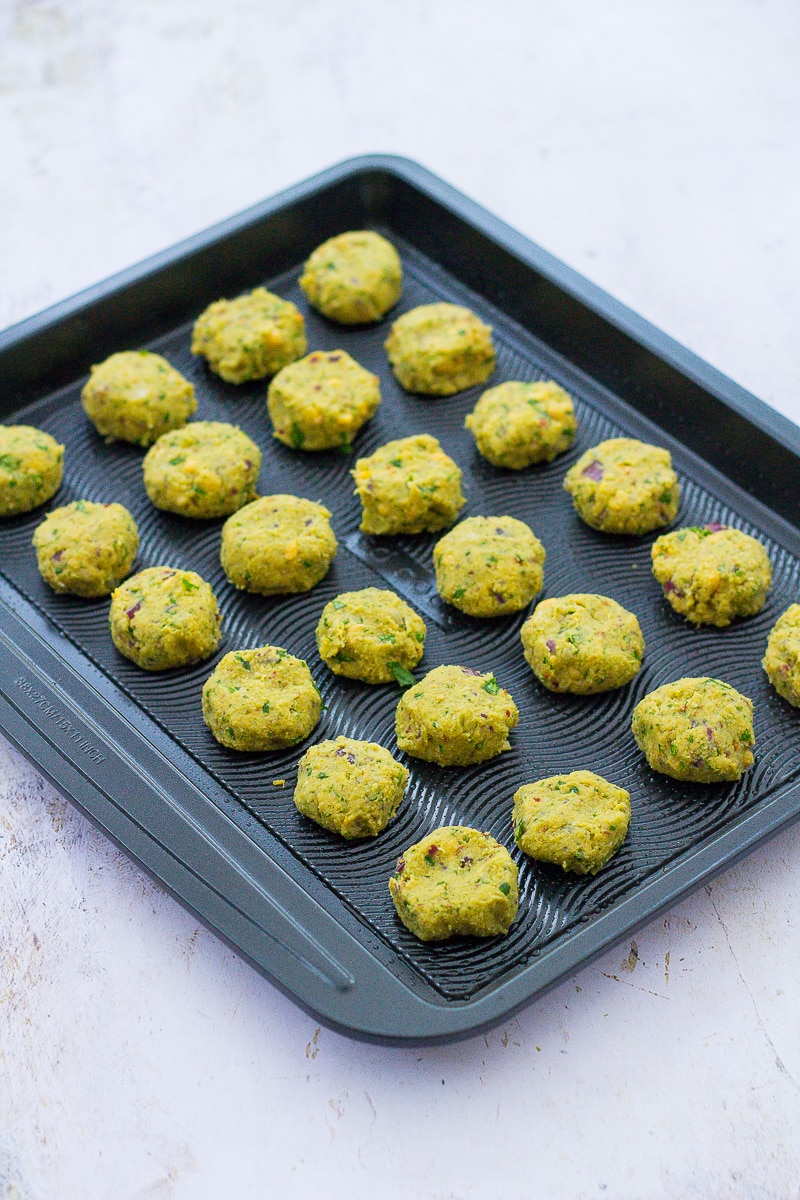 Uncooked Easy Oven Baked Falafel on a baking sheet