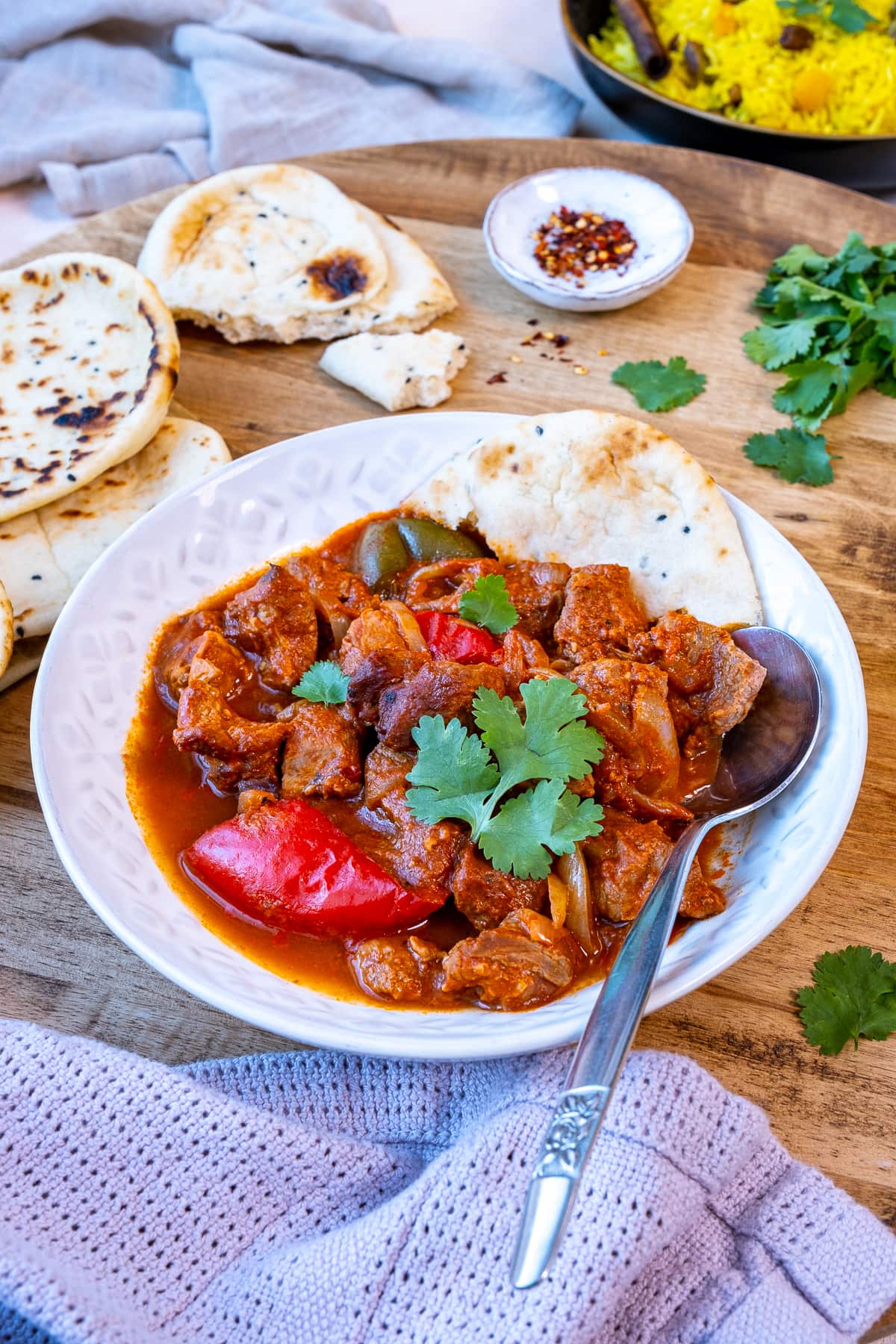 Easy Peasy Lamb Curry in a bowl with naan bread