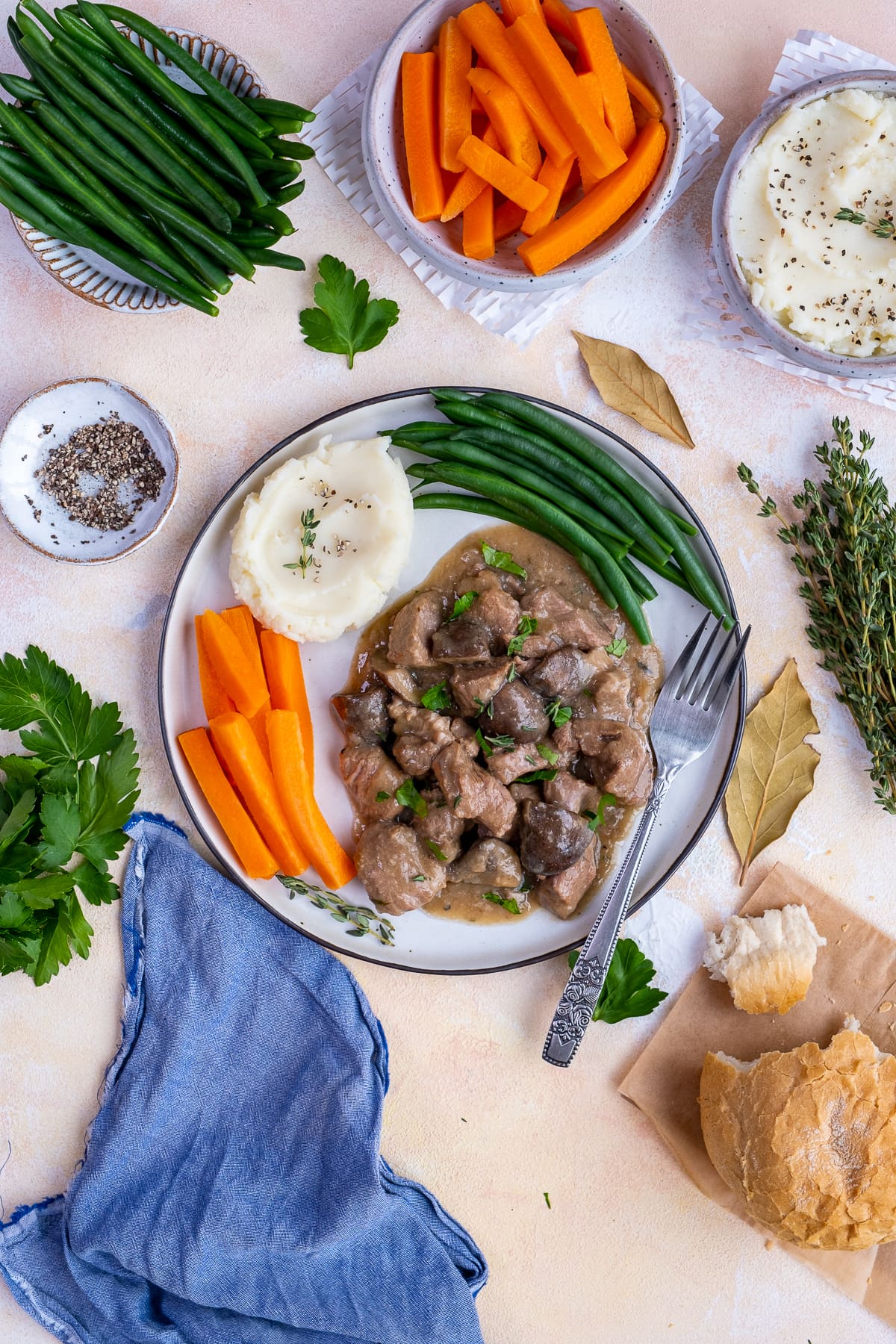 Overhead shot of Easy Peasy Lamb Stew on a plate with mash and vegetables