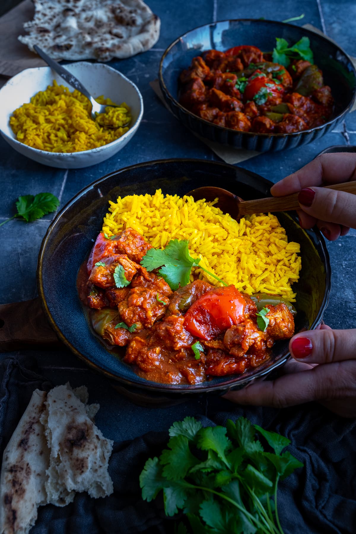 Easy Peasy Pork Curry in a bowl with yellow pilau rice