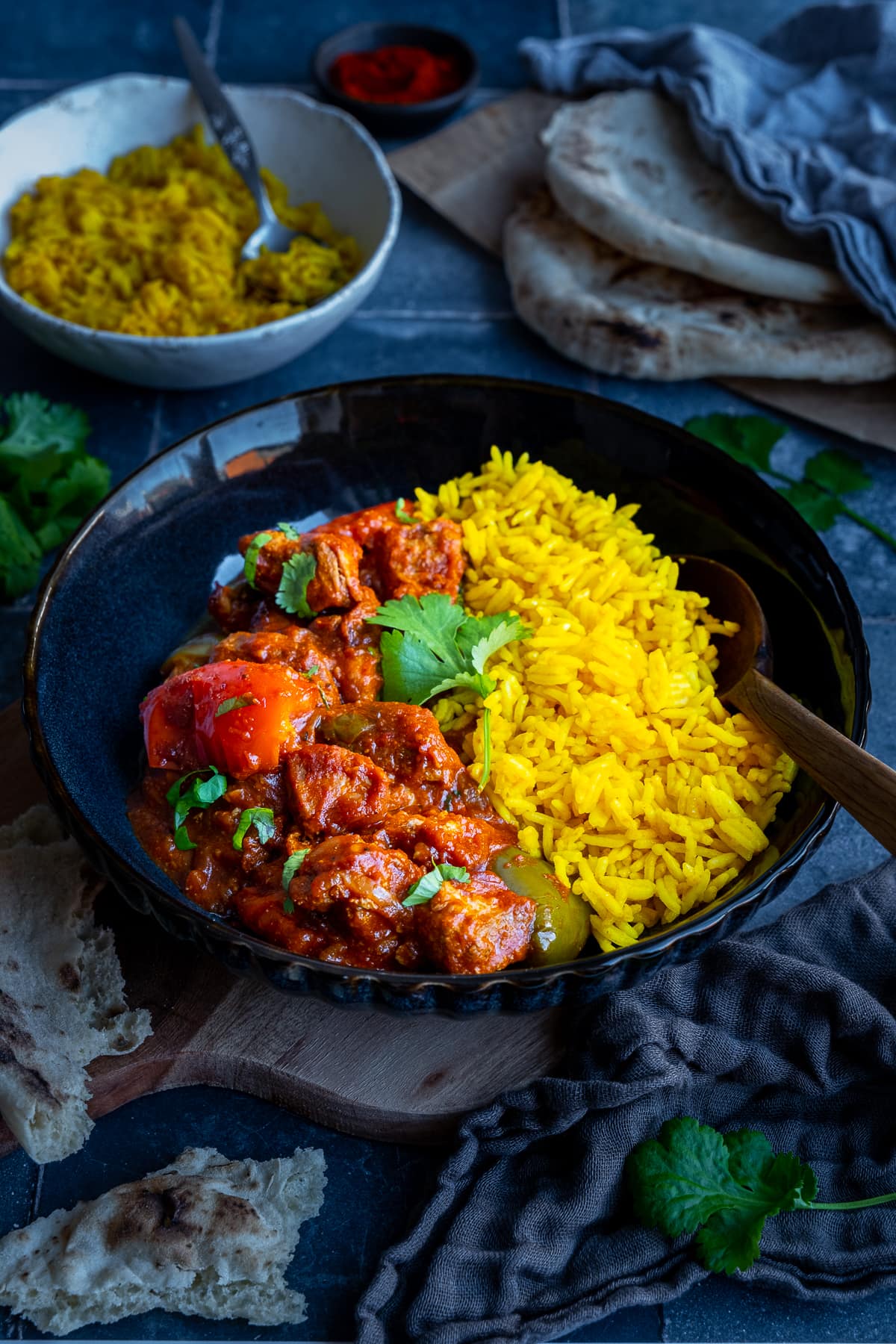 Easy Peasy Pork Curry in a bowl with yellow pilau rice