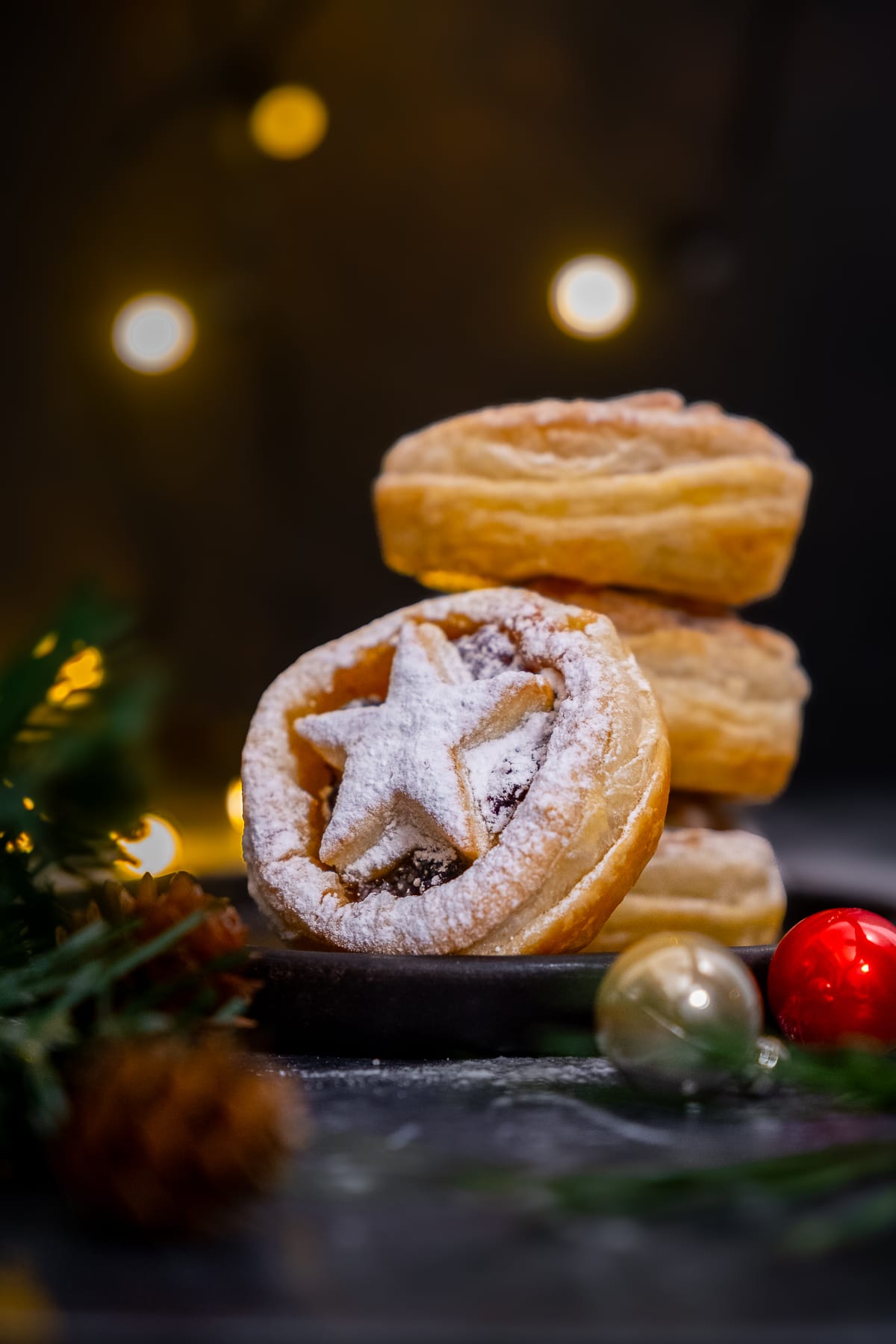 3 Easy Puff Pastry Mince Pies in a stack, 1 mince pie leaning against the stack