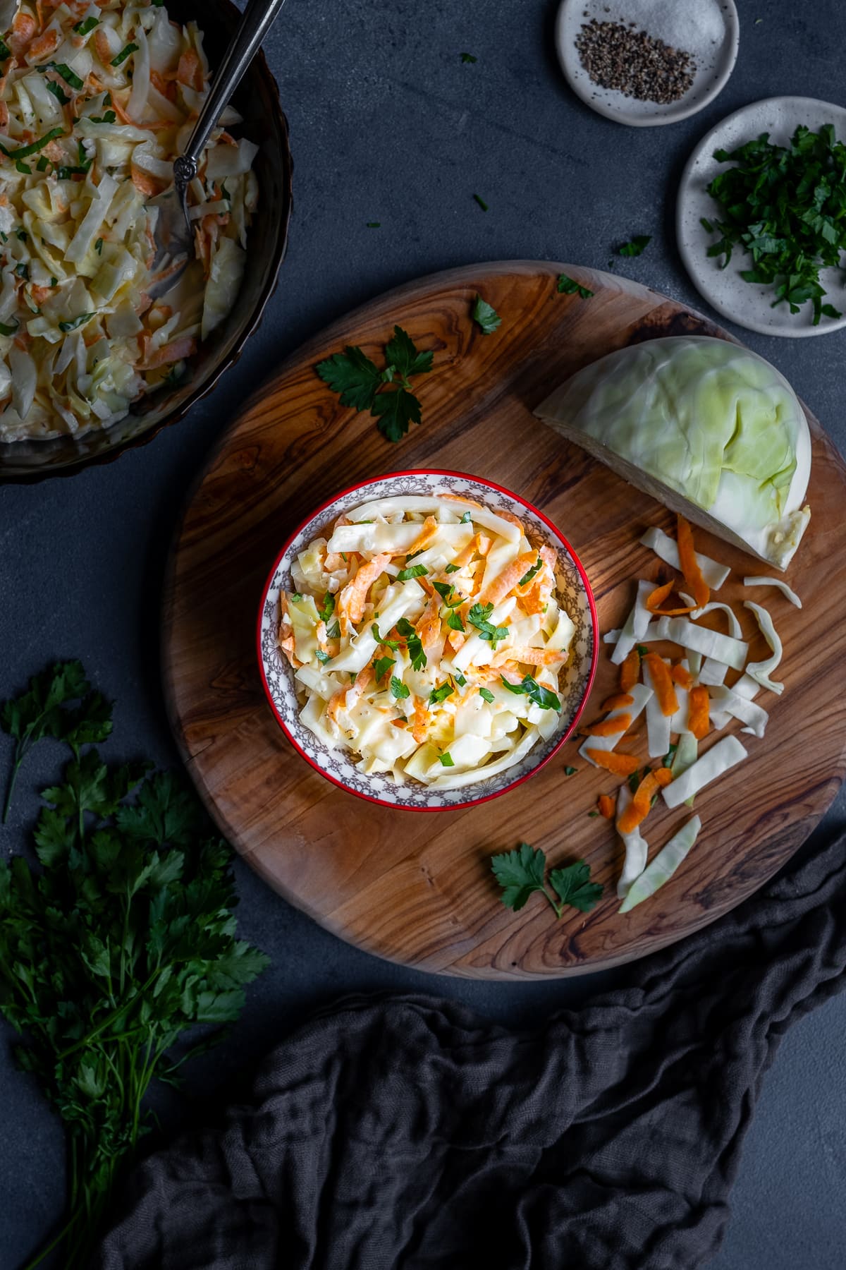 Homemade Nando’s Coleslaw on a board with chopped cabbage and carrots