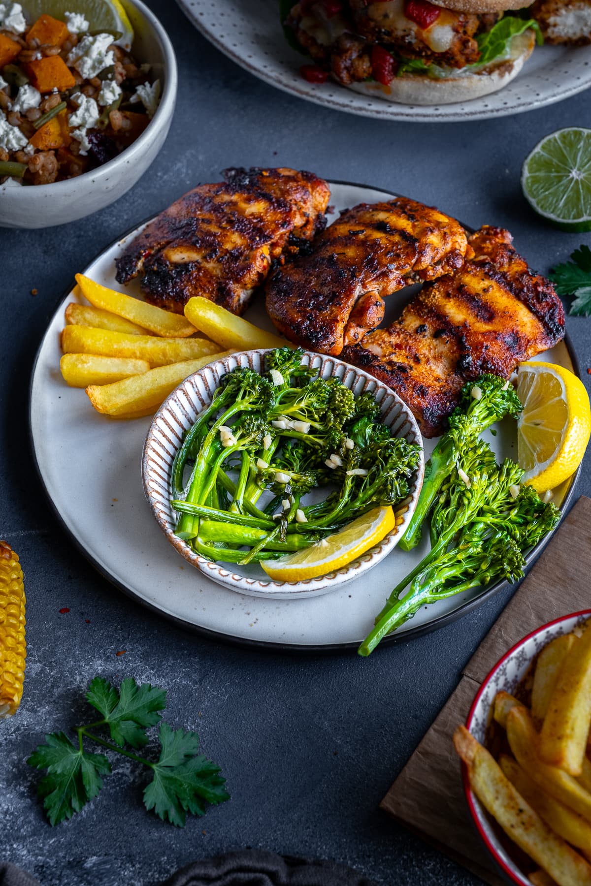 Homemade Nando’s Lemon and Garlic Broccoli on a plate with Peri Peri chicken breasts