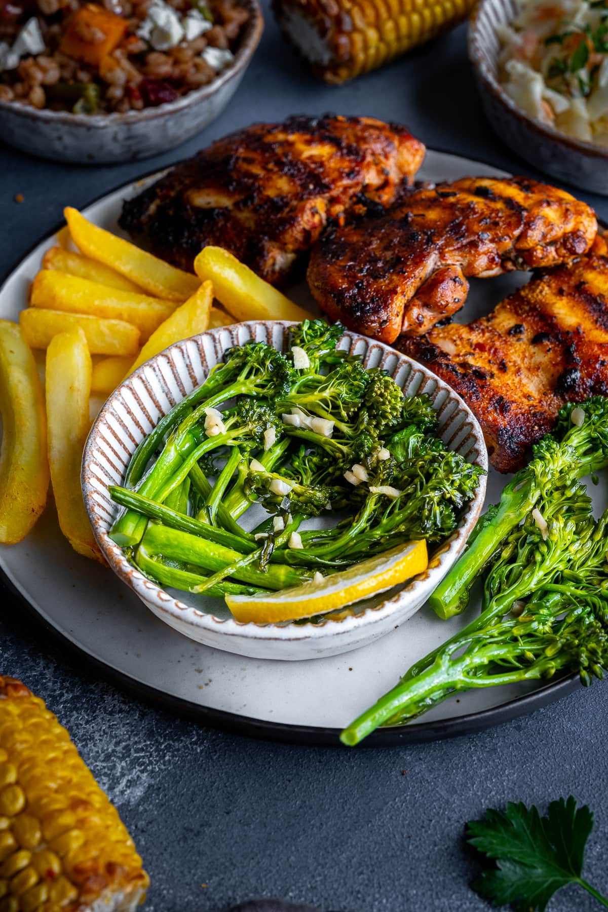 Homemade Nando’s Lemon and Garlic Broccoli on a plate with Peri Peri chicken breasts