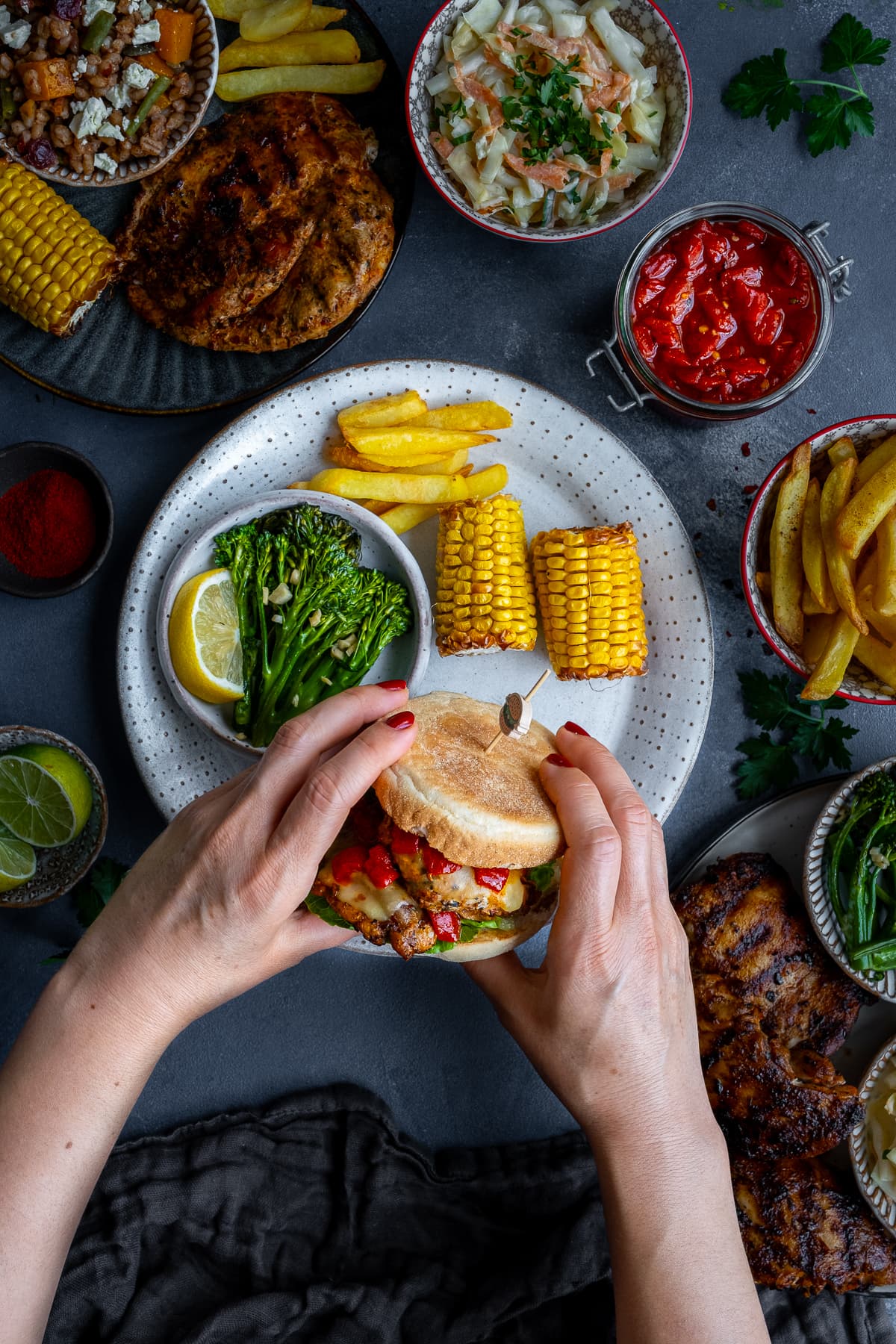 A Homemade Nandos Sunset Burger being held up to the camera