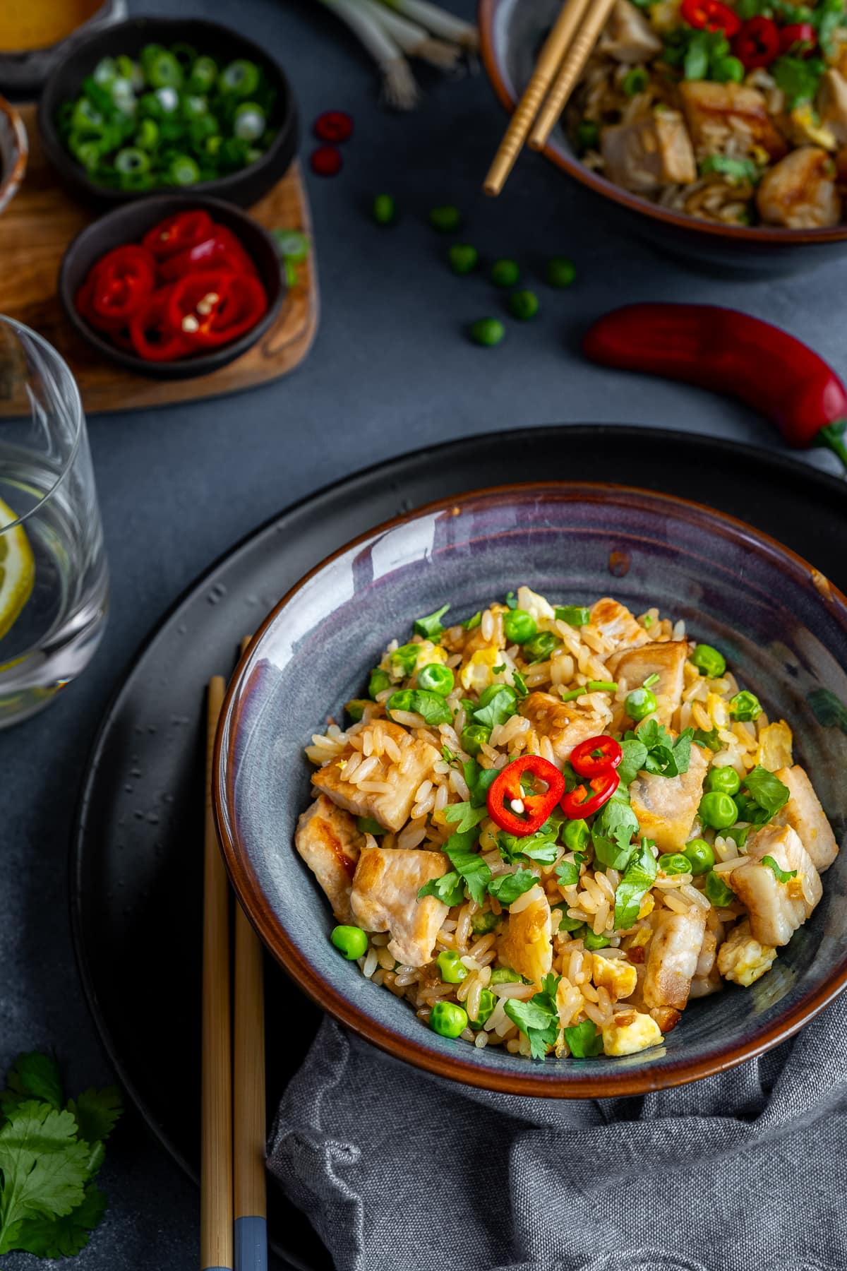 Leftover Pork Fried Rice in a bowl, with chopsticks