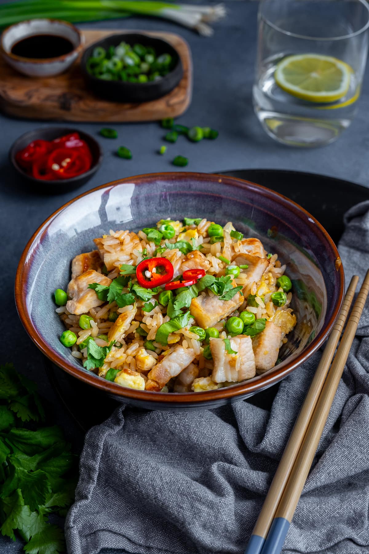 Leftover Pork Fried Rice in a bowl, with chopsticks