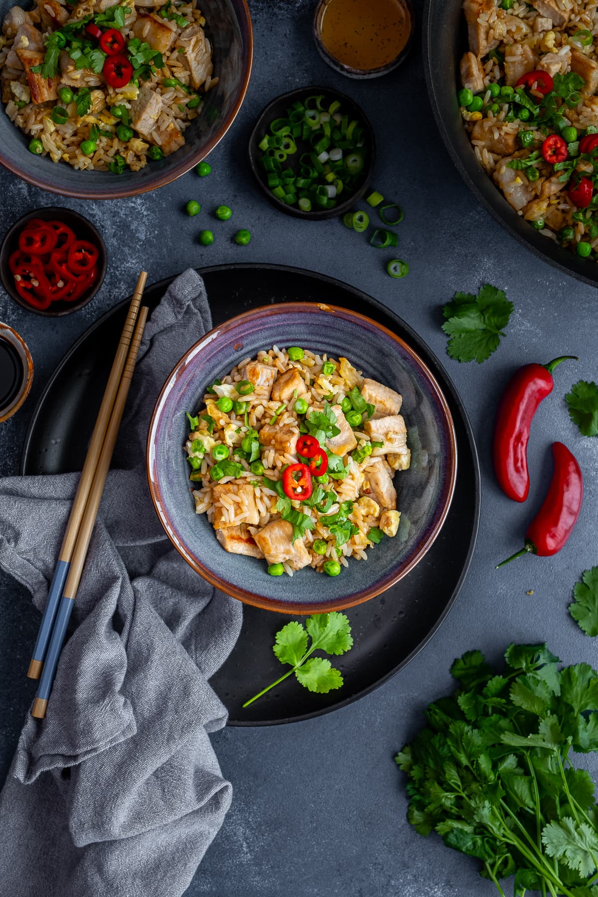 Overhead shot of Leftover Pork Fried Rice in a bowl, with chopsticks