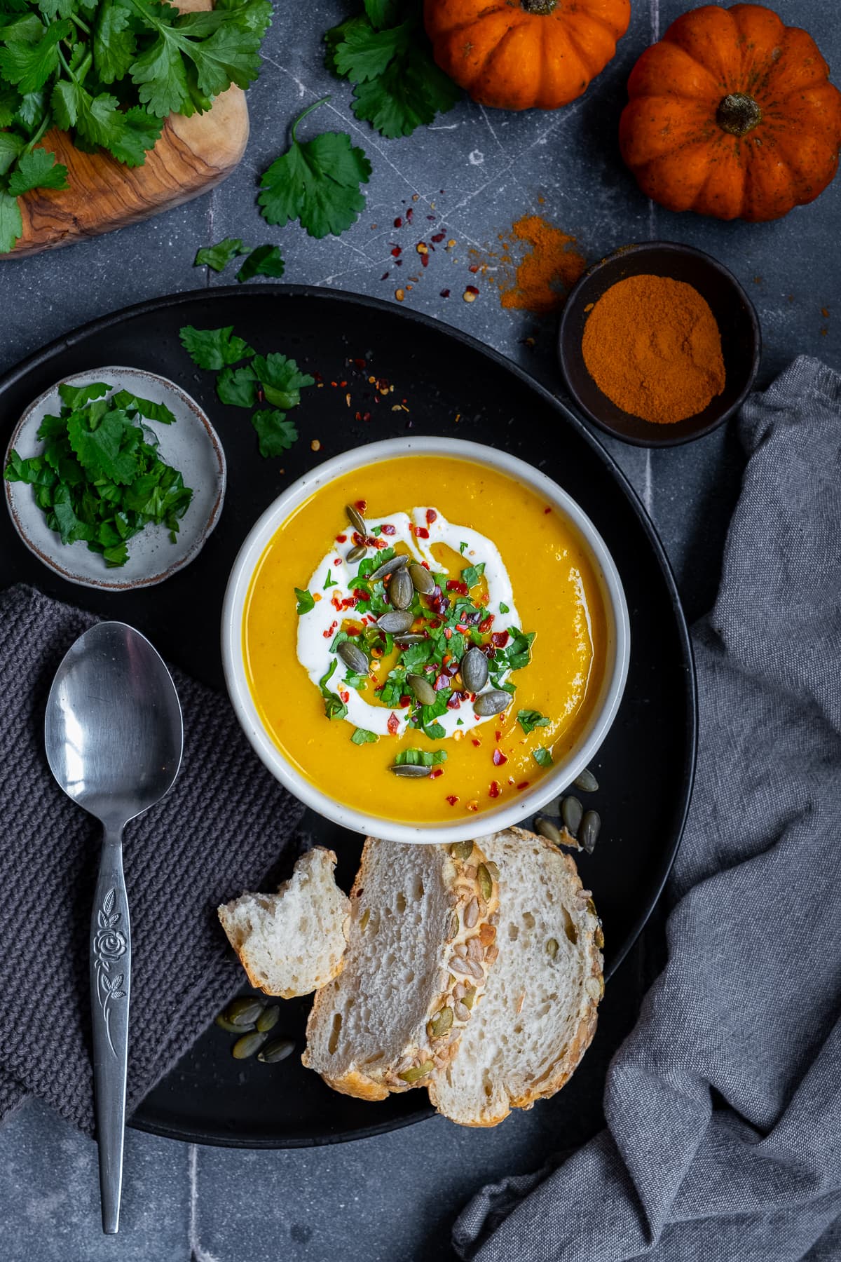 Overhead Spicy Pumpkin Soup served with bread