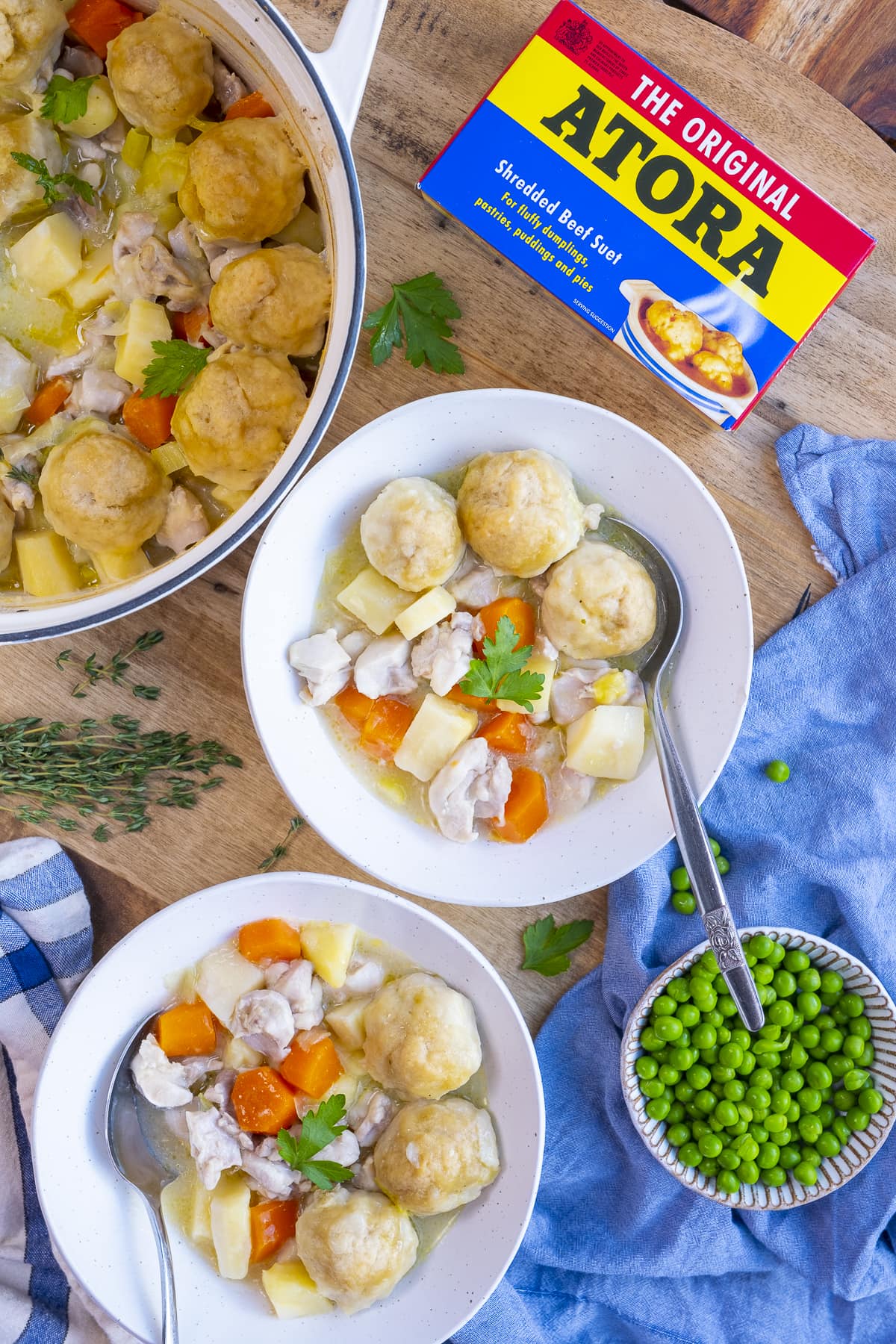 Traditional British Suet Dumplings in bowls next to a box of atora