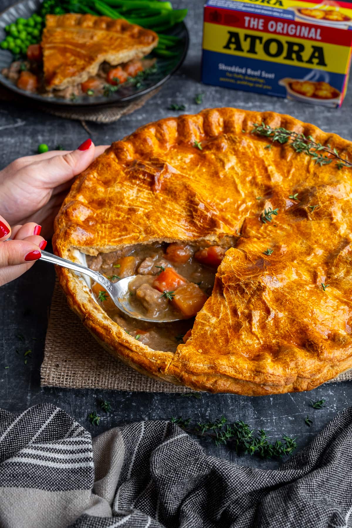 Traditional Suet Crust Steak Pie - one portion cut out to reveal the filling inside