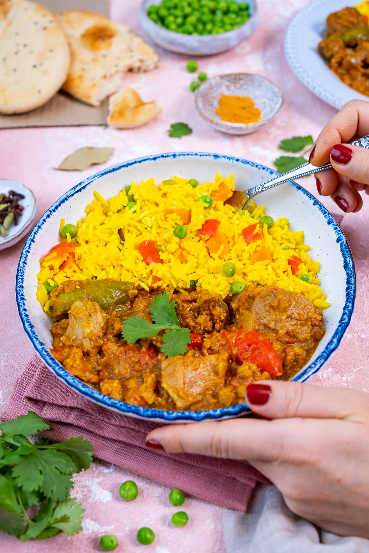 Vegetable Pilau Rice in a bowl with Easy Lamb Dhansak